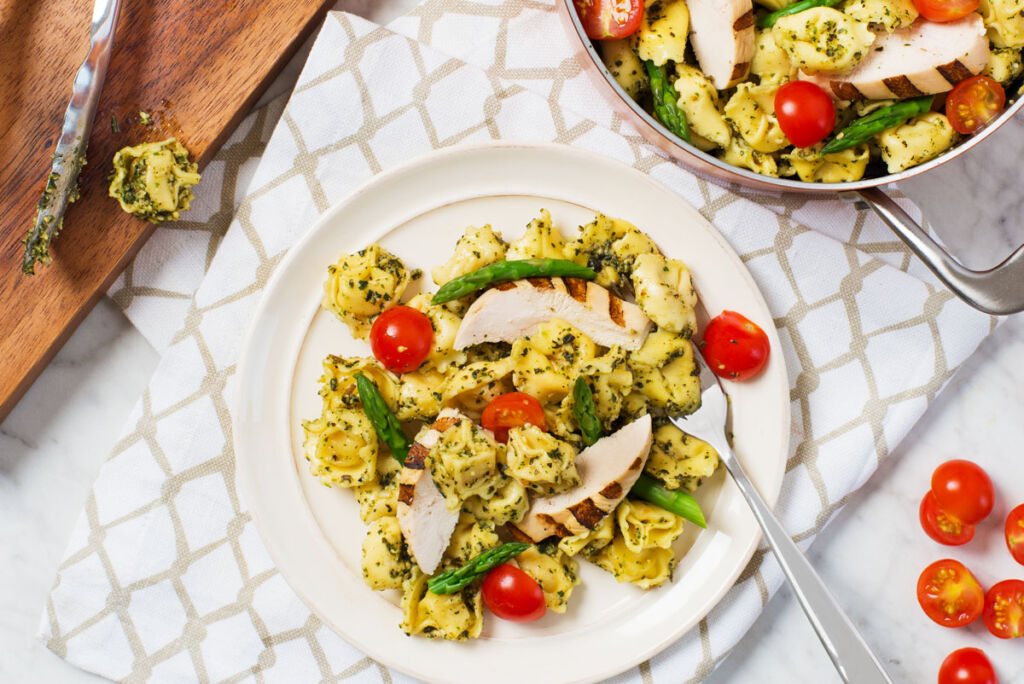 prime_chicken_with_pesto_tortellini_and_cherry_tomatoes-How to Cook Tortellini with Menu Hacks